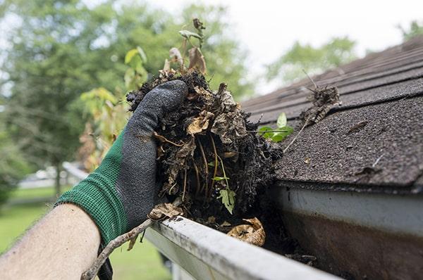 signs that your gutters need cleaning include overflowing water, visible debris, and sagging gutters